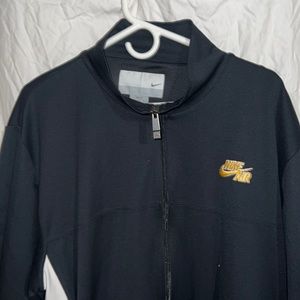 Black and yellow XXL Nike zip up warm-up shirt.
